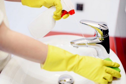 Cleaner taking safety precautions in a property before cleaning